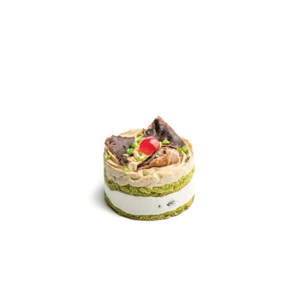 Pequeno bolo redondo em camadas de pistache verde e creme branco, com chantilly, cereja e chocolate